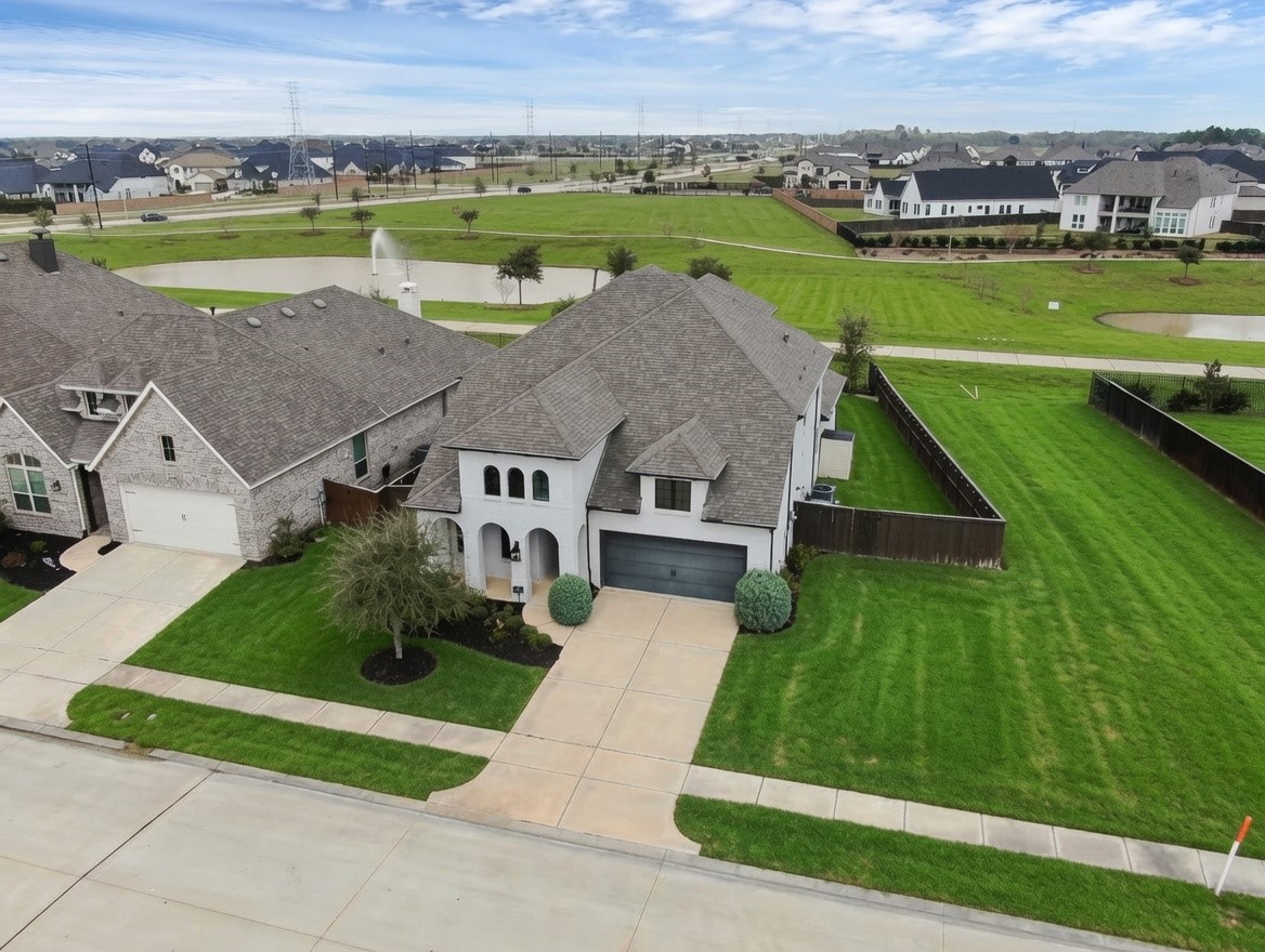 6718 Waxbill Road Katy, TX 77493 - Photo 1 of 48 an aerial view of a house with big yard