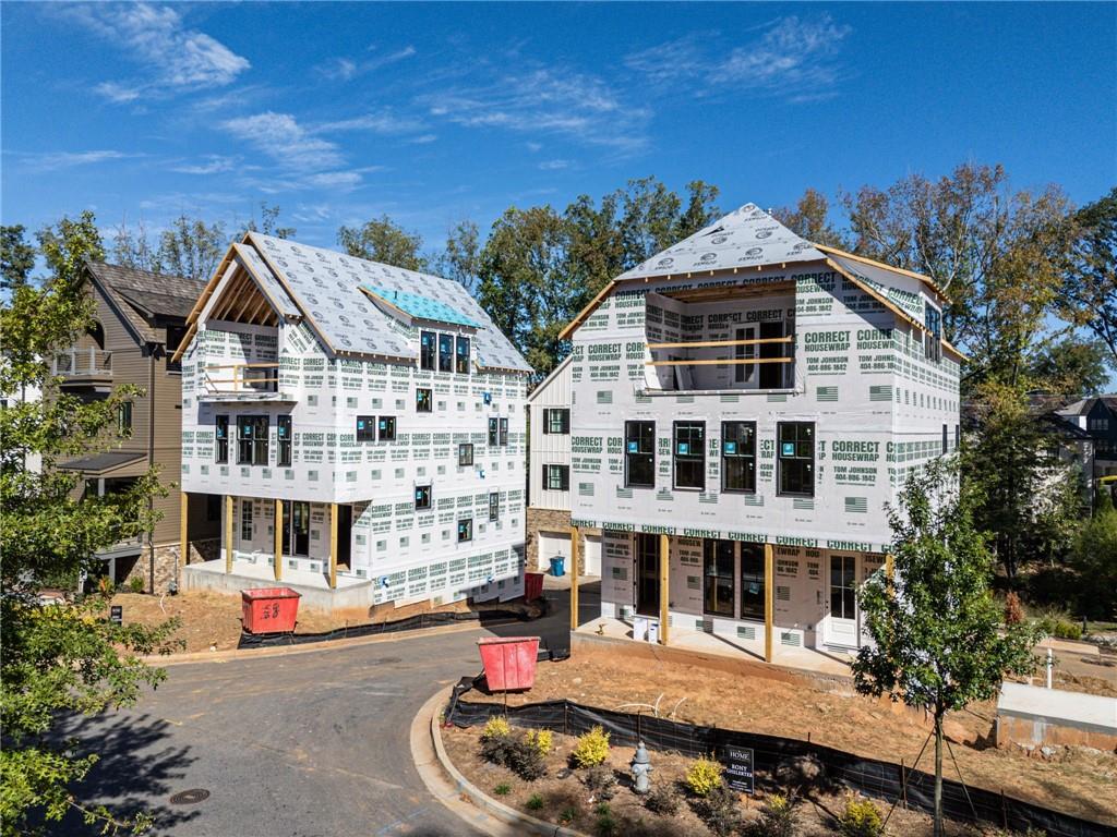 135 Alcovy Terrace Alpharetta, GA 30009 - Photo 11 of 56 a front view of a building with a yard