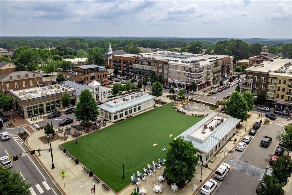 135 Alcovy Terrace Alpharetta, GA 30009 - Photo 39 of 56 an aerial view of a city with lots of residential buildings ocean and mountain view in back