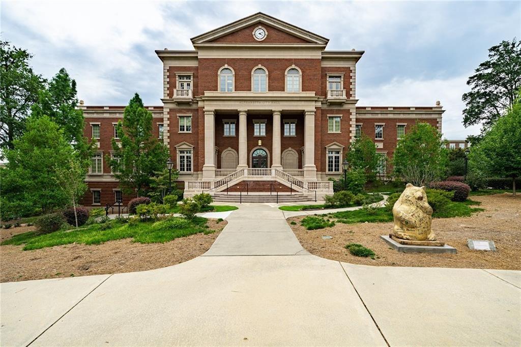 135 Alcovy Terrace Alpharetta, GA 30009 - Photo 44 of 56 a front view of a house with yard