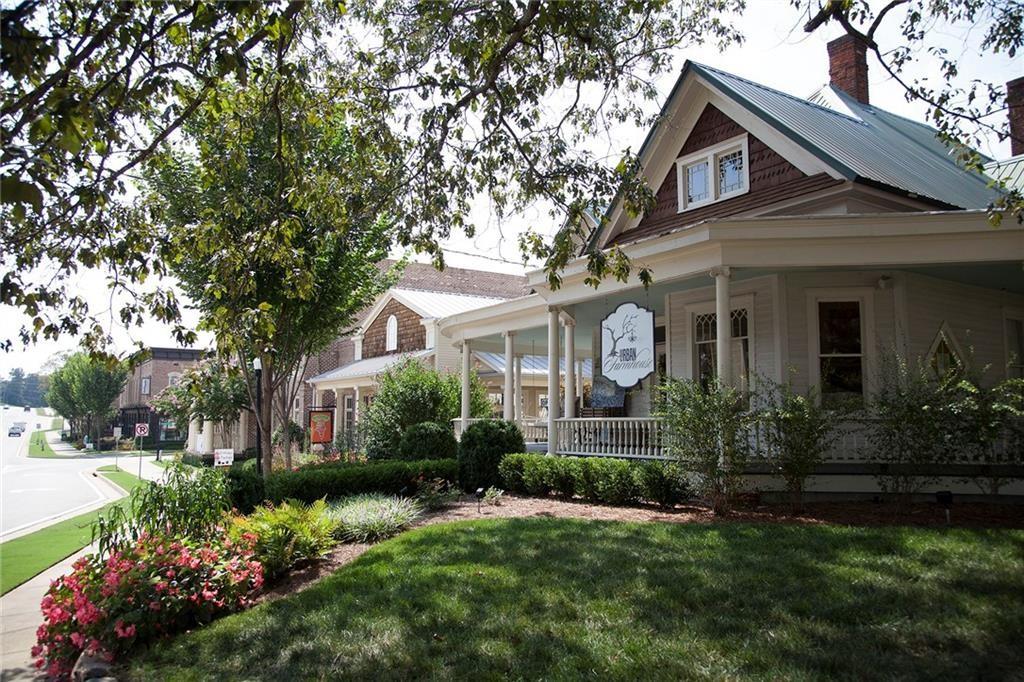 135 Alcovy Terrace Alpharetta, GA 30009 - Photo 49 of 56 a front view of a house with a garden