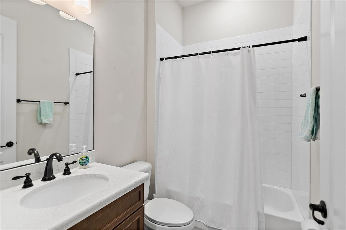 96014 Enclave Manor Fernandina Beach, FL 32034 - Photo 17 of 32 a bathroom with a sink toilet and shower