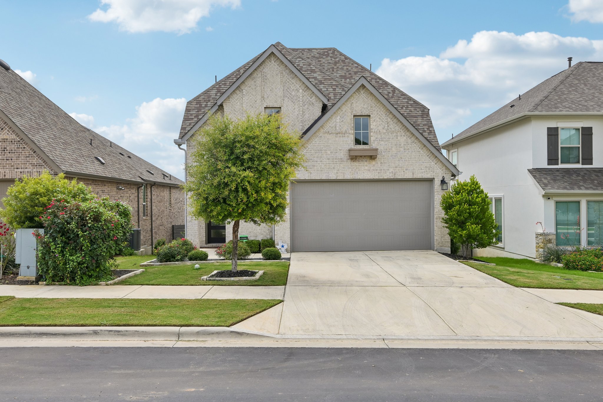 A well-maintained lawn and sturdy brick exterior create inviting curb appeal for this residential dwelling.