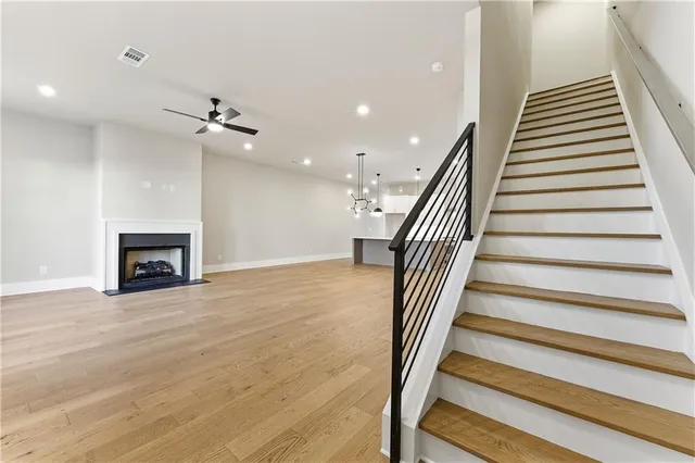 a view of entryway and hall with wooden floor