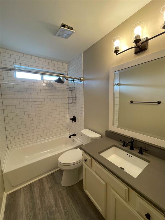 2917 Roxboro Road Euless, TX 76039 - Photo 16 of 20 a bathroom with a sink a toilet and shower