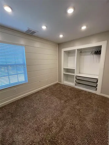 a view of an empty room with a fireplace