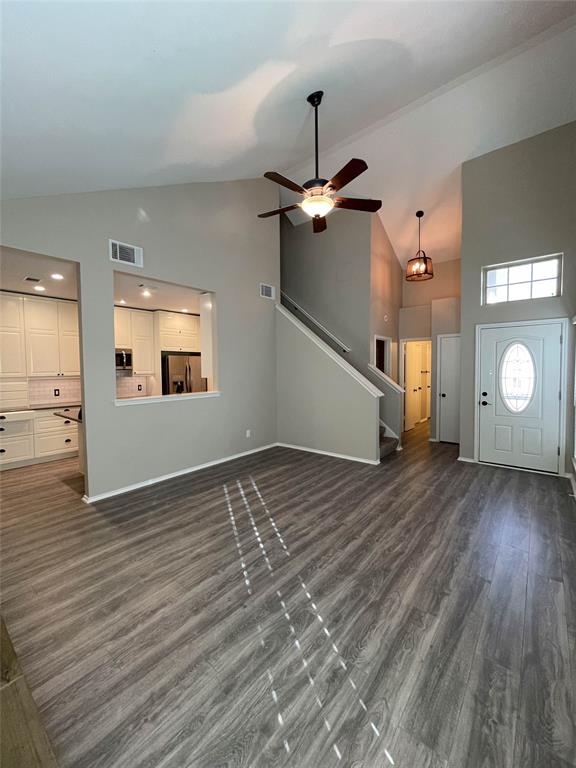 2917 Roxboro Road Euless, TX 76039 - Photo 5 of 20 wooden floor in an empty room with a window