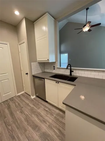 a kitchen with a sink and a refrigerator