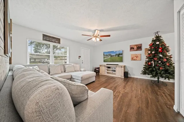 a living room with furniture and a large window