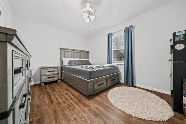 a living room with a bed furniture and a window