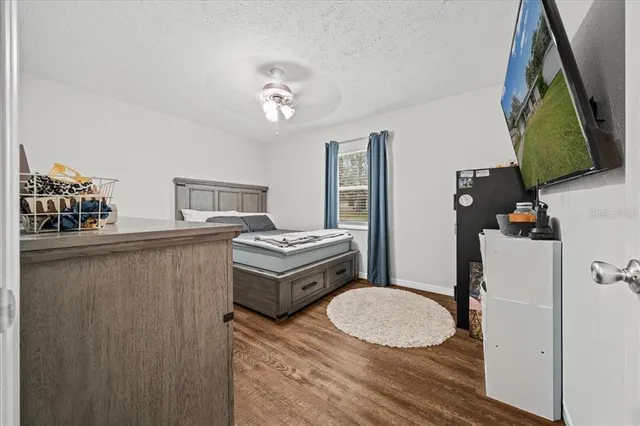 a bathroom with a sink mirror and vanity