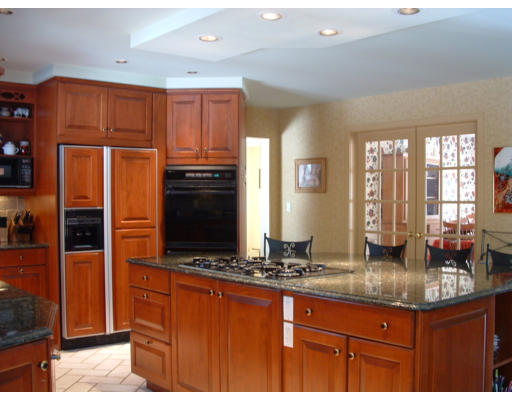 72 Hutchinson Road Sutton, MA 01590 - Photo 6 of 20 a kitchen with granite countertop a stove and large window