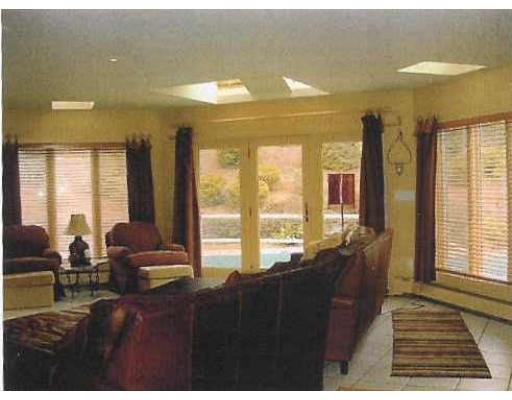 72 Hutchinson Road Sutton, MA 01590 - Photo 9 of 20 a living room with furniture and large windows