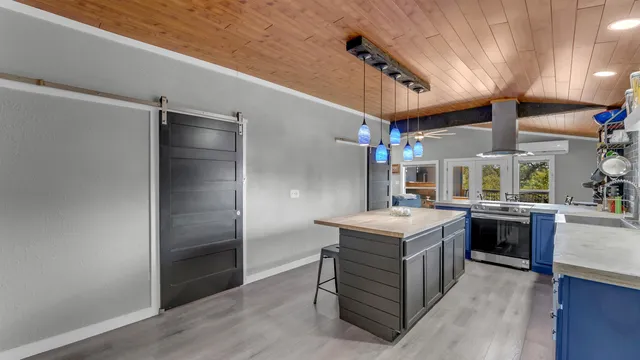 a kitchen with a stove and a refrigerator