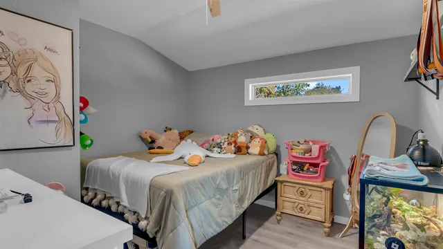 a bedroom with a bed and dresser