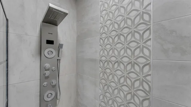 a bathroom with a shower and a mirror