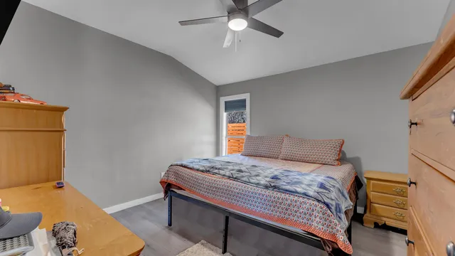a bedroom with a bed and a chandelier