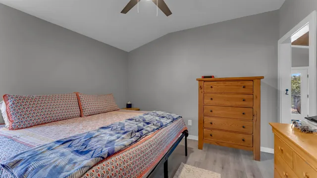 a bedroom with a bed and a dresser