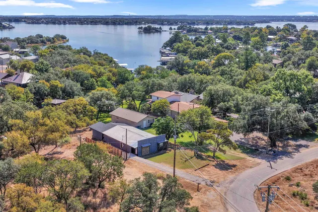 an aerial view of a house with a lake view