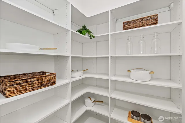 a kitchen with white cabinets and a stove