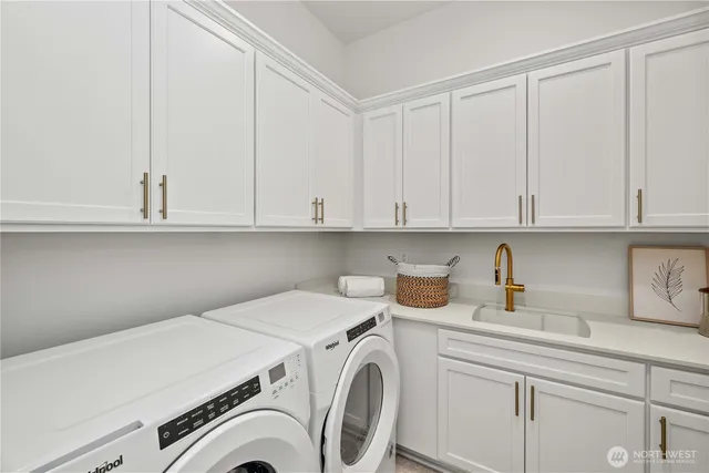a view of storage and utility room with cabinets