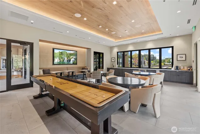 a living room with furniture a rug and a large window