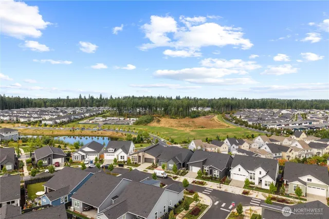 an aerial view of a house with a swimming pool