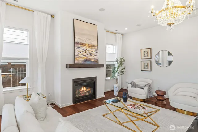 a living room with furniture a rug and a fireplace