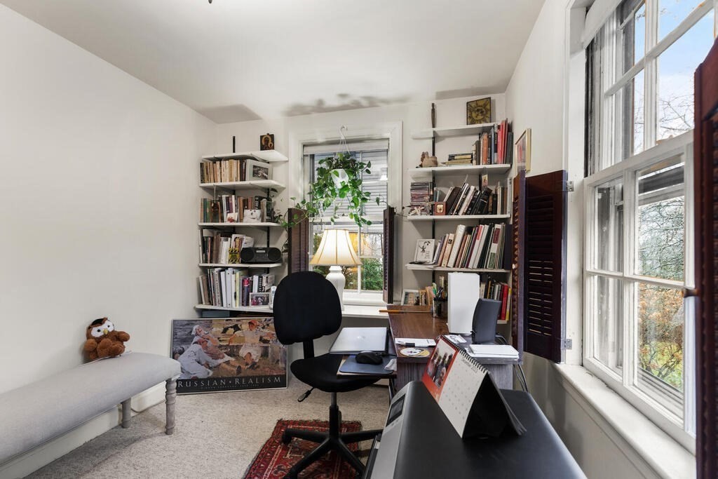 9 Preston Road Lexington, MA 02420 - Photo 19 of 25 a view of a workspace with furniture and a book shelf