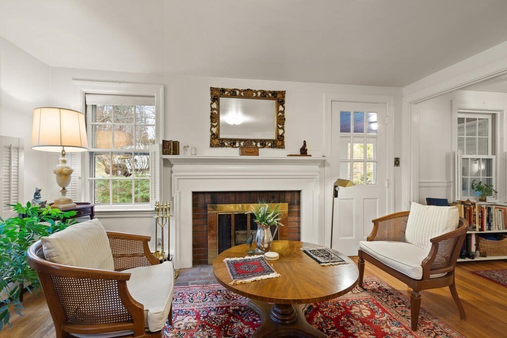 9 Preston Road Lexington, MA 02420 - Photo 3 of 25 a living room with furniture and a fireplace