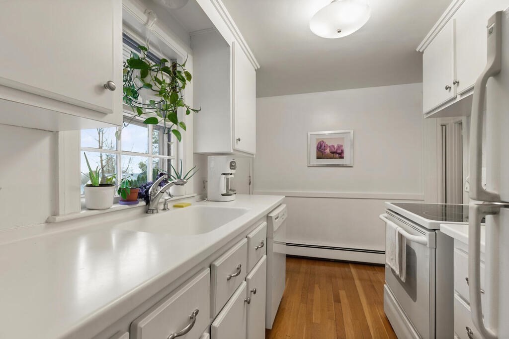 9 Preston Road Lexington, MA 02420 - Photo 10 of 25 a view of a kitchen with a sink and dishwasher
