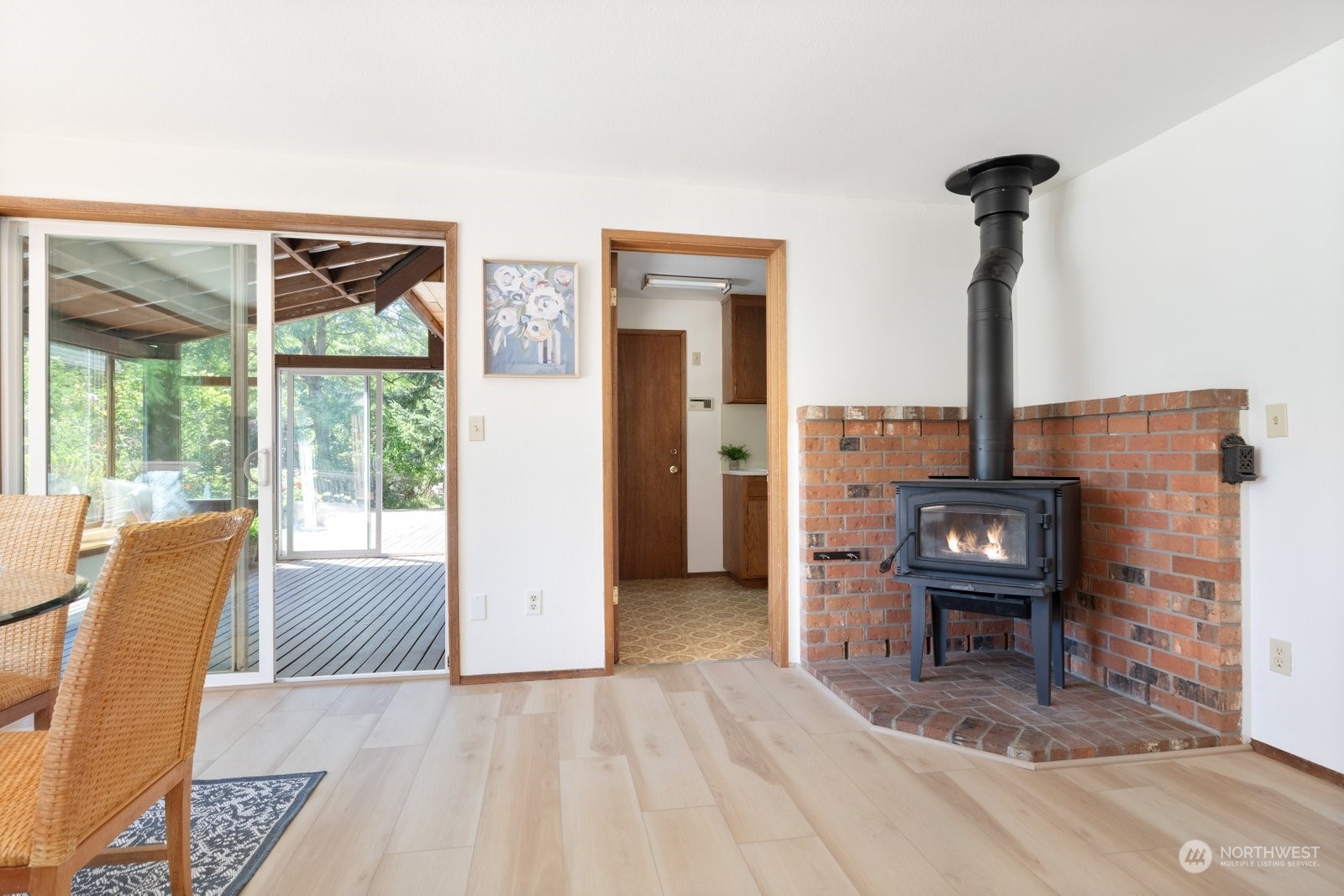 3550 Swede Hill Road Clinton, WA 98236 - Photo 11 of 40 a living room with furniture and a fireplace