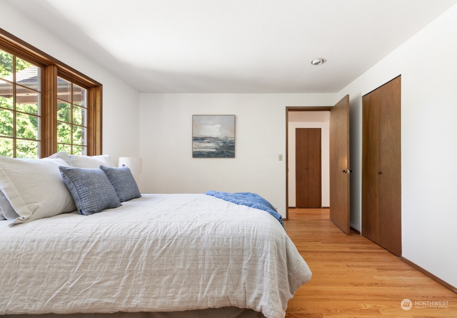 3550 Swede Hill Road Clinton, WA 98236 - Photo 14 of 40 a bed sitting in a spacious bedroom next to a window and dresser