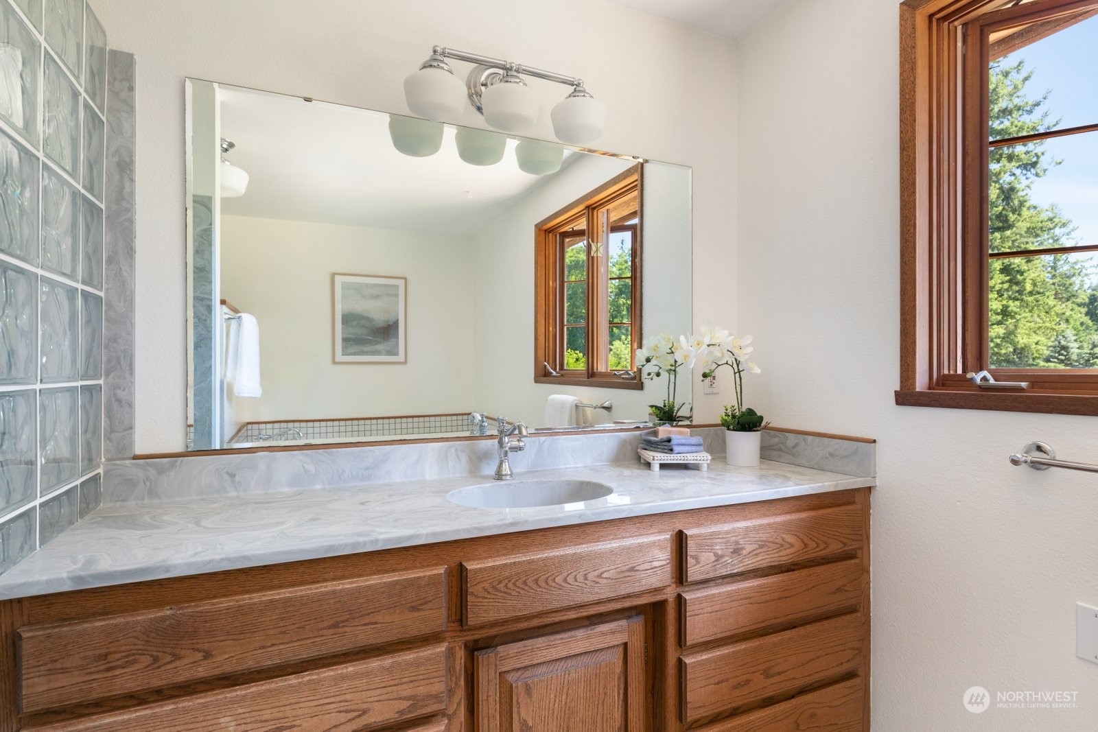 3550 Swede Hill Road Clinton, WA 98236 - Photo 20 of 40 a bathroom with a sink and a mirror