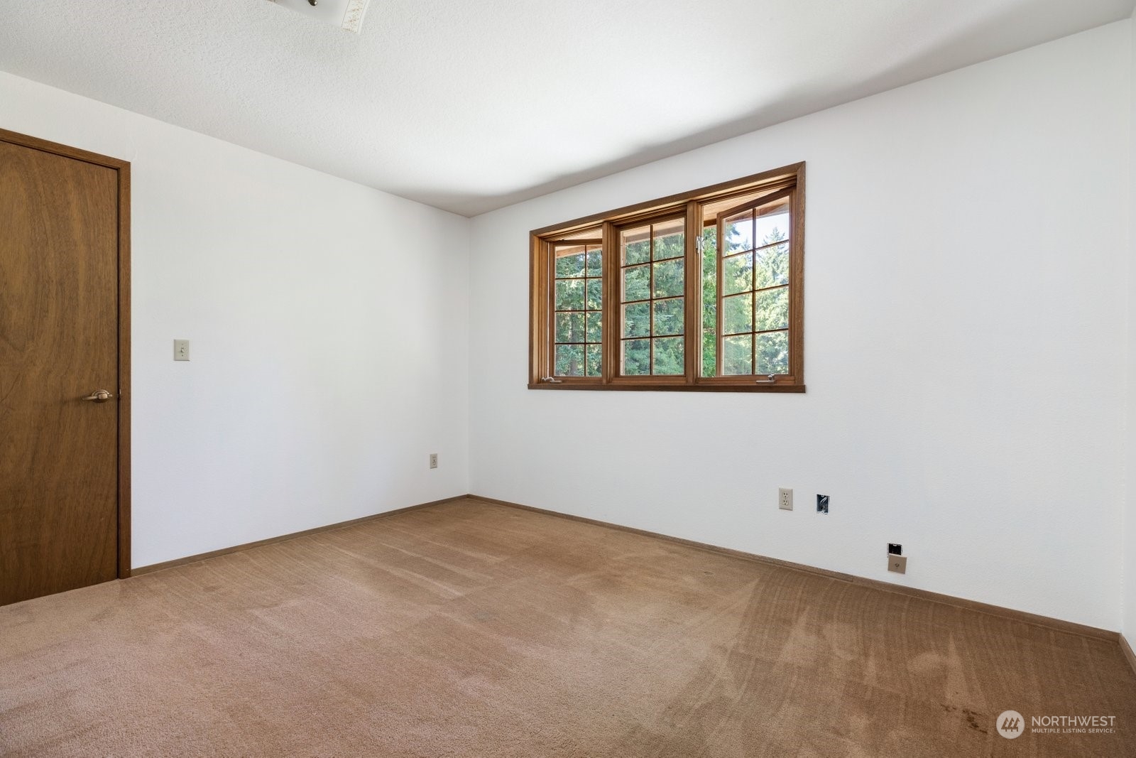3550 Swede Hill Road Clinton, WA 98236 - Photo 21 of 40 an empty room with a window