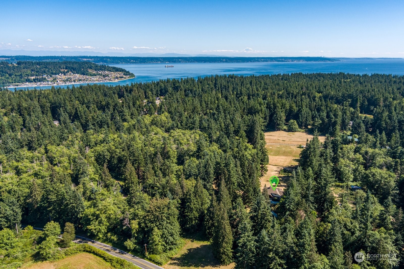 3550 Swede Hill Road Clinton, WA 98236 - Photo 36 of 40 a view of a city with lush green forest
