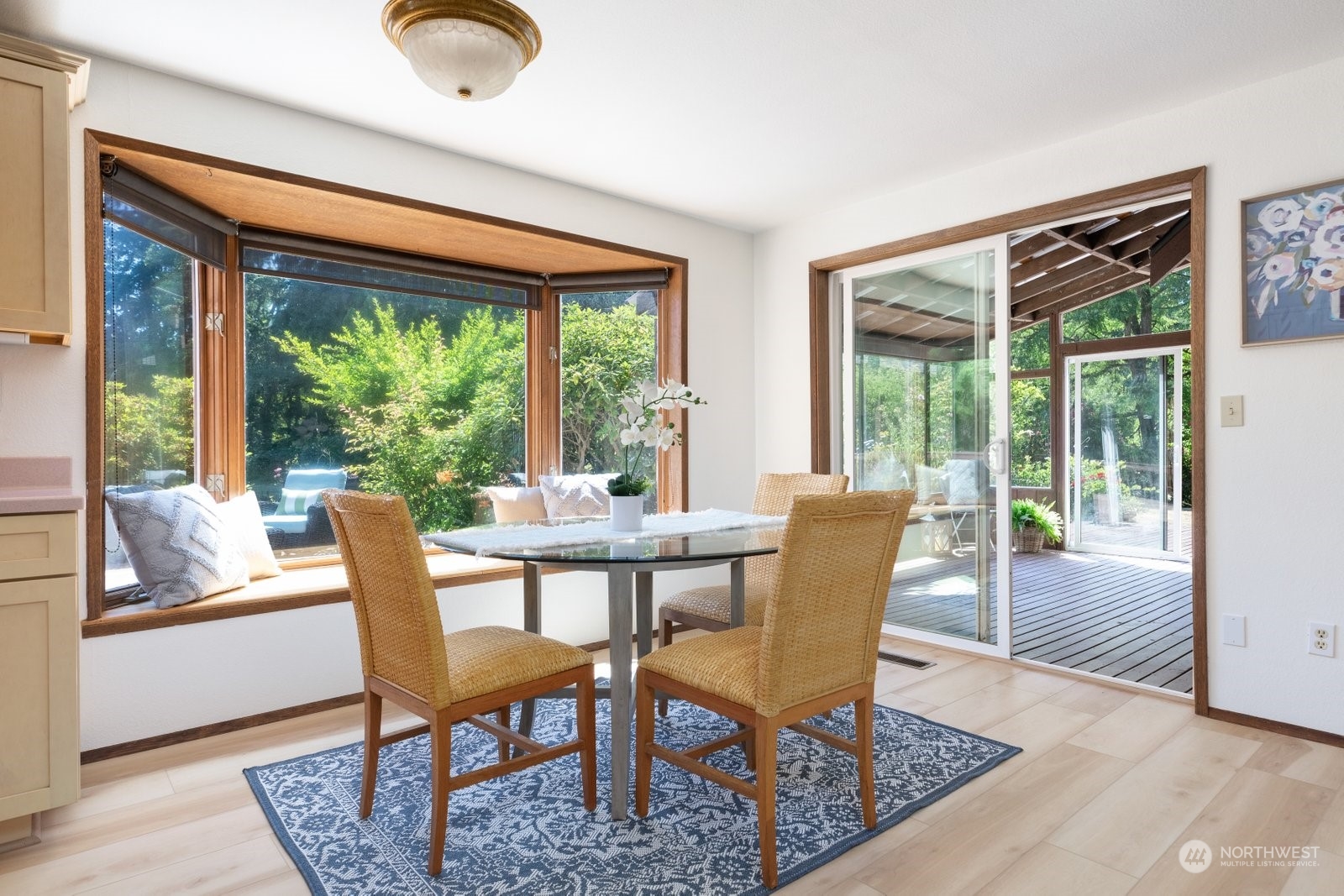 3550 Swede Hill Road Clinton, WA 98236 - Photo 10 of 40 a dining room with furniture wooden floor and a rug