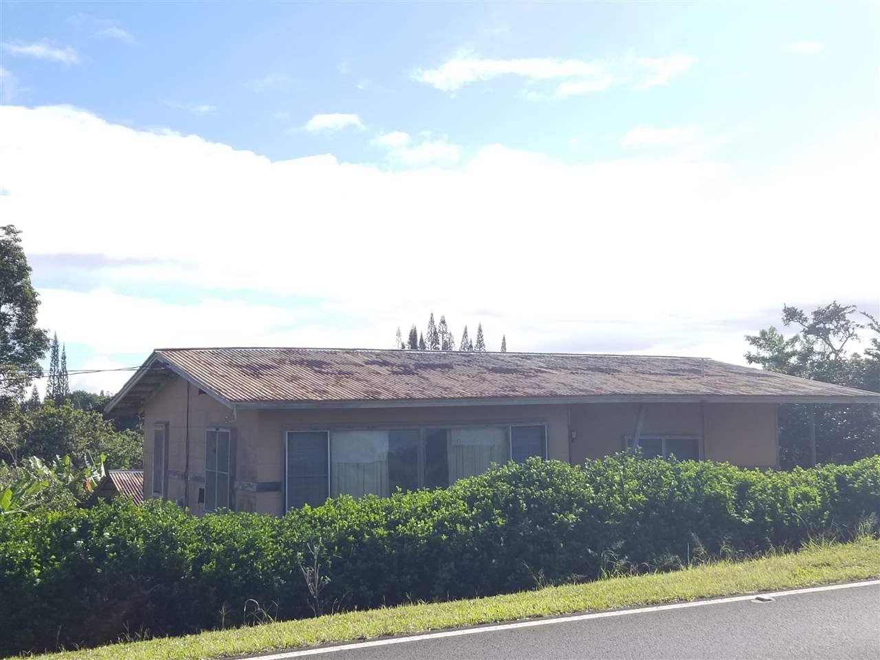 2165 Kokomo Road Haiku, HI 96708 - Photo 2 of 12 a view of a house with a yard