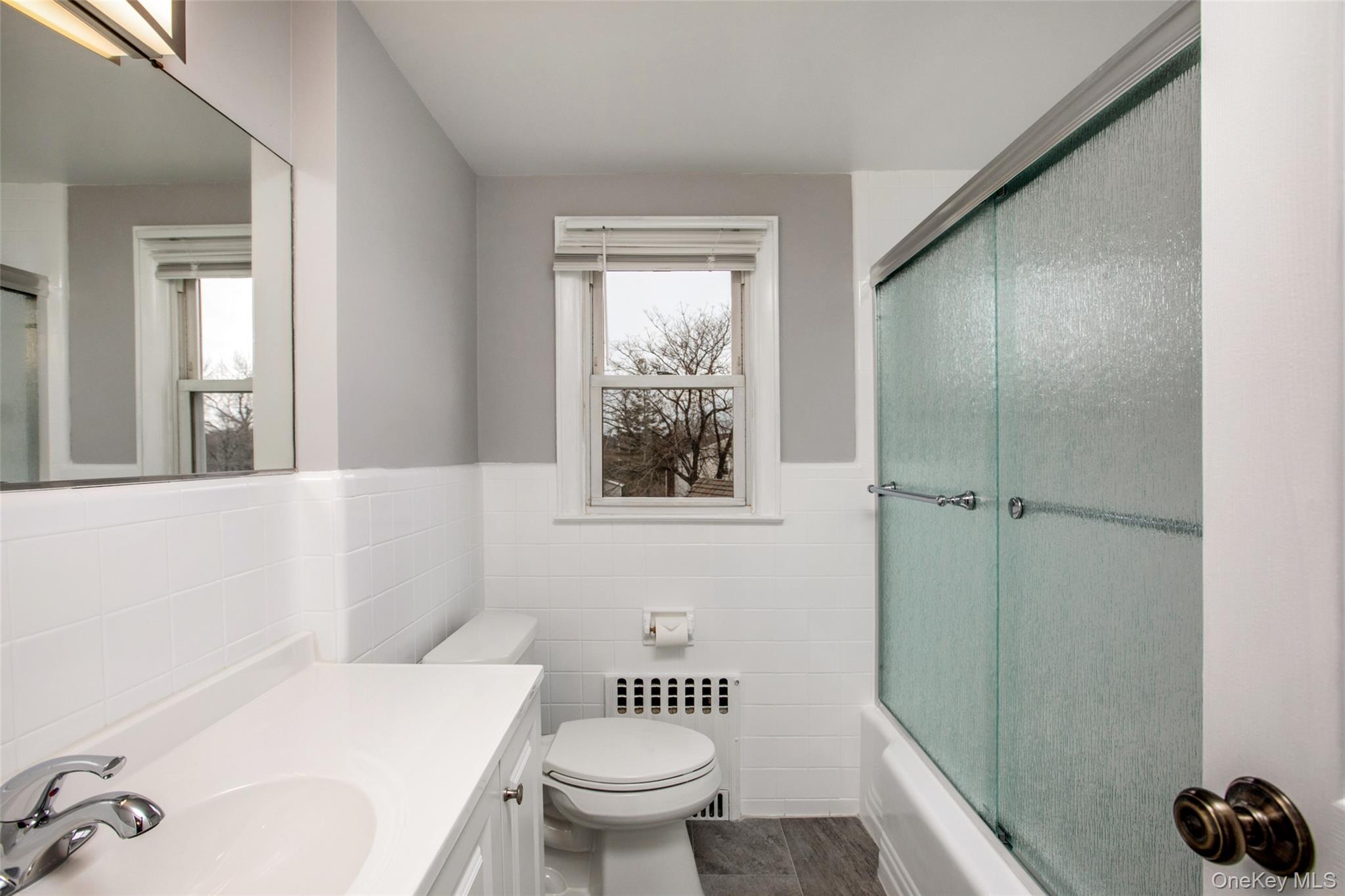 40 Division Street Rye Brook, NY 10573 - Photo 5 of 20 Freshly updated modern bathroom