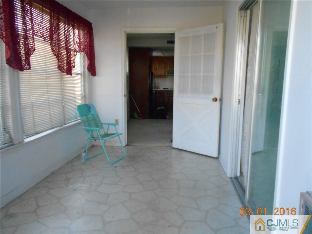 271 B Old Nassau Road Monroe Township, NJ 08831 - Photo 2 of 8 a view of a hallway with seating area