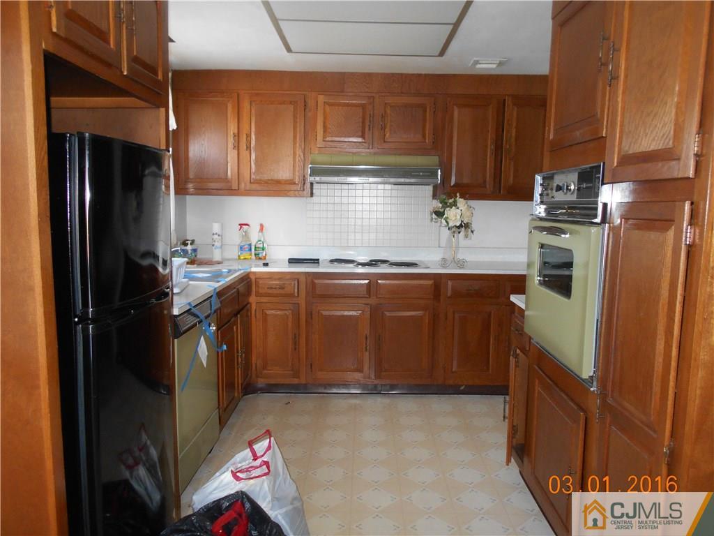 271 B Old Nassau Road Monroe Township, NJ 08831 - Photo 6 of 8 a kitchen with a sink stove and refrigerator