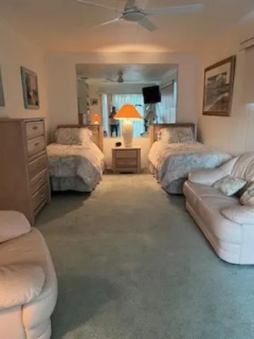 a bedroom with bed and window