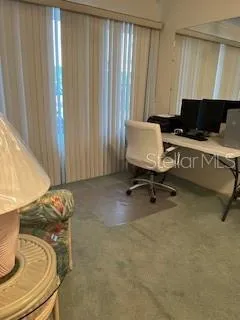 a living room with a couch and a window