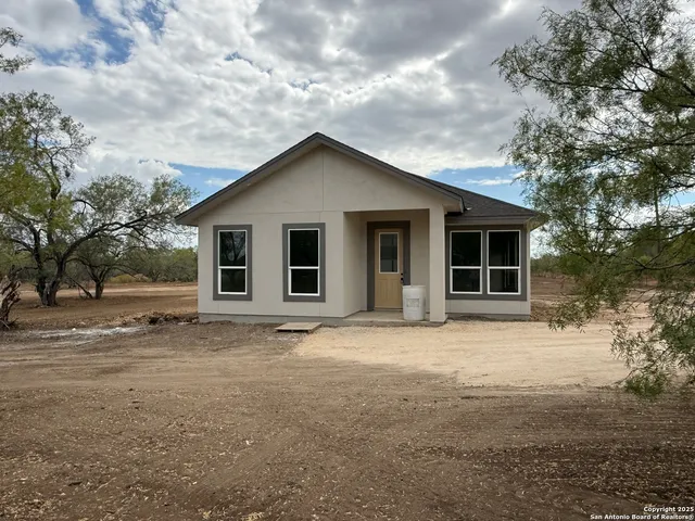 a house with trees in the background