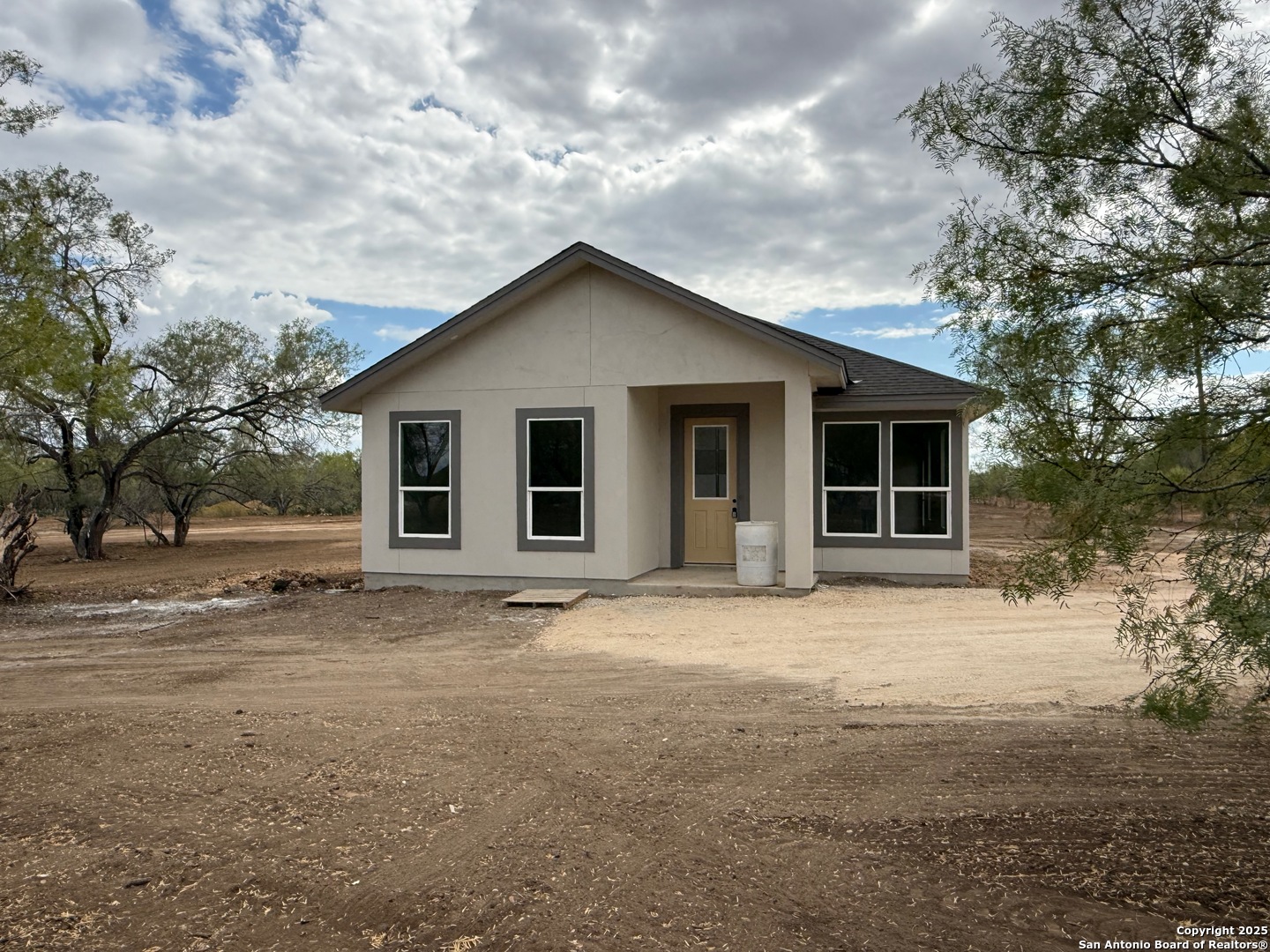 a house with trees in the background