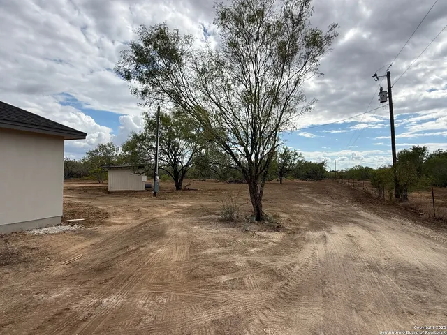 a view of backyard with green space