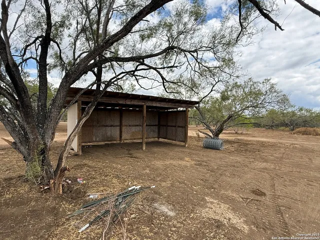 a view of a house with a snow in the yard