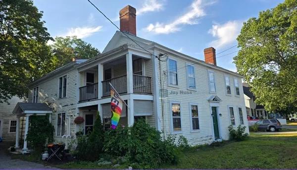 a front view of a house with an outdoor space