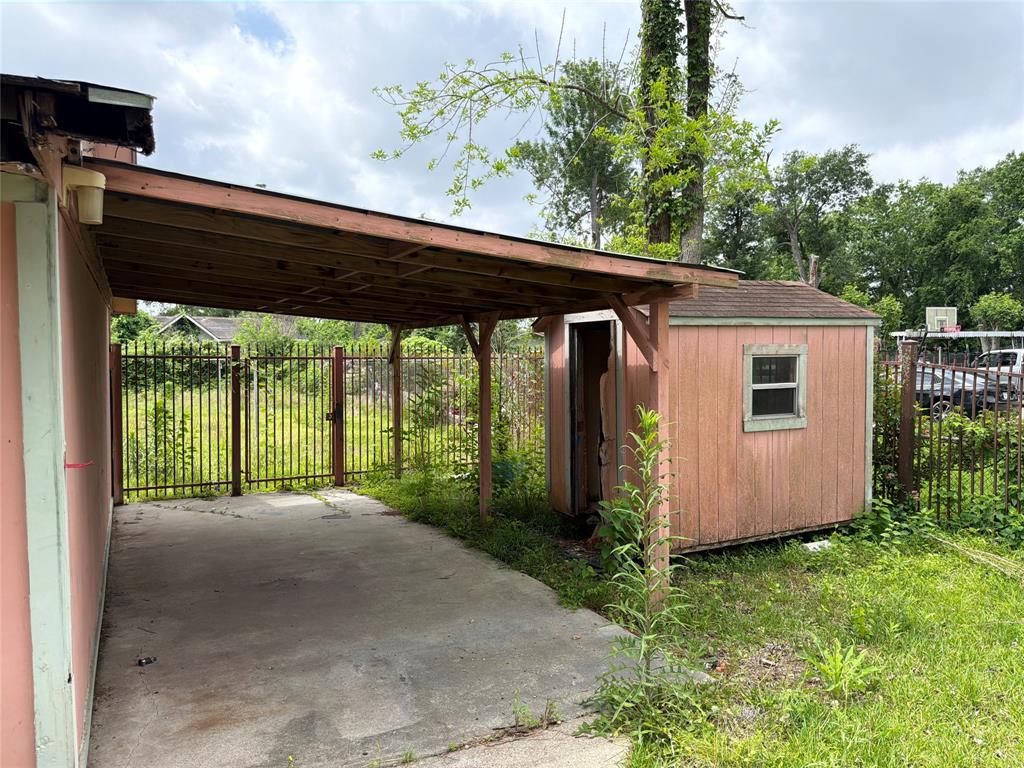 4600 Ireland Street Houston, TX 77016 - Photo 5 of 13 a backyard of a house with a garden and plants