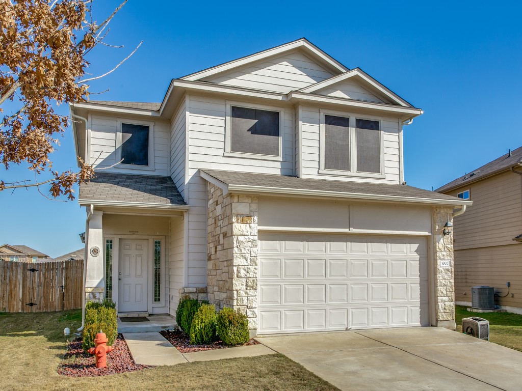 1002 Hawkeye Point Road Georgetown, TX 78626 - Photo 1 of 1 a front view of a house with a yard